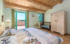 Sleeping area. One of the rooms upstairs, the one with the terrace