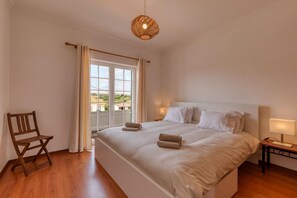 Sleeping area. King size bed with access to the balcony