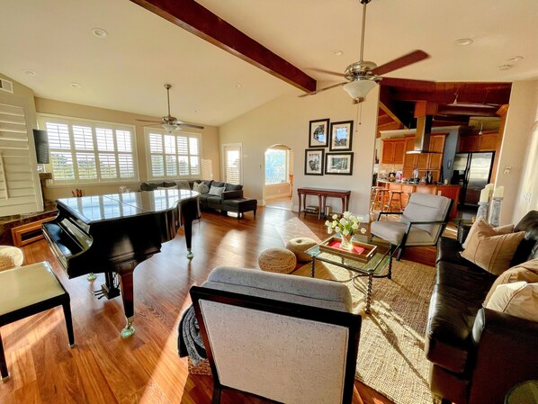 The Grand piano room with ocean views, lots of seating and smart TV