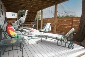 Fenced-in, enclosed back deck area for lounging. This deck is fully covered so it can be enjoyed in rain or shine.