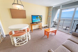 - Wake up to stunning ocean views from the balcony in this beachfront retreat - Comfortable living area with a smart TV, dining space, and easy access to the beach - Perfect for a relaxing stay near restaurants, entertainment, and local attractions