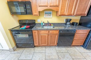 - Fully equipped kitchen featuring modern appliances and sleek granite countertops - Cook your favorite meals with ease using the oven, microwave, and a coffee maker - Plenty of cabinet space for storage, making it ideal for extended stays