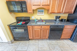 - Fully equipped kitchen featuring modern appliances and sleek granite countertops - Cook your favorite meals with ease using the oven, microwave, and a coffee maker - Plenty of cabinet space for storage, making it ideal for extended stays