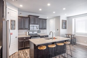 Kitchen Island - The Kitchen Island comfortably seats 4 adults and creates a great space for serving and preparing meals.