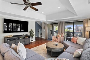 Second Floor:  Family room that walks out to a covered balcony with sound views.