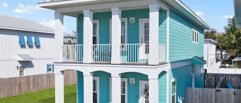 Beach vibes run throughout this beautifully constructed 2021 double balcony home. Enjoy partial bay views and easy walkable access to historic downtown Pensacola with the beach only a short drive away.