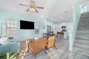 Open concept living space with 70 inch smart TV ready for all streaming stations (with your own login) such as Netflix, Disney+, Amazon Prime, etc. High speed internet.Plenty of seating for family gatheringsReal plants add a  light and airy feel