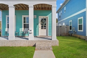 Front patio seating to relax and enjoy the partial bay views with your morning coffee.Double balcony feature allows for sitting outside on both the upstairs and downstairs patios.