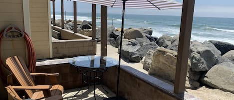 Relaxing private  patio steps from the ocean.