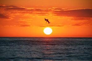 A glass of wine and a sunset to take your breath away. 