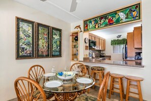 Four person dining table with bar seating.