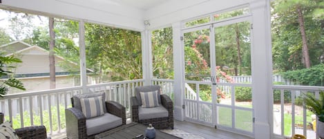 Welcome to our screened porch!  Gardenia shrubs provide fragrance in the Spring!