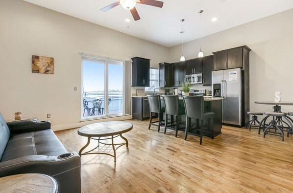 Living room/ Seating area/ Kitchen