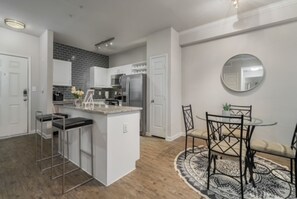 Dining Area with Bar Height Granite Counter Top