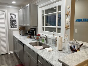 Kitchen includes basic oil / spices, blender, coffee, microwave, & toaster oven.