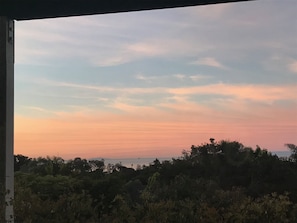 Enjoy your morning coffee watching the sun rise on covered veranda