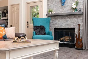 A warm and welcoming living room with a fireplace for those relaxing nights in.