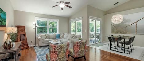 Main living area has hardwood floors and tile. Sliding doors to the patio.