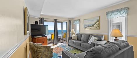 This cozy oceanfront living room is perfect for family movie night.