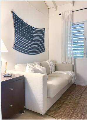 Bedrm #2. Pull-out sofa bed. Comfy queen mattress, nightstand, closet, AC unit.