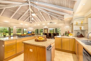 Kitchen features propane cooktop, new  knives, stainless steel pot and pan set.