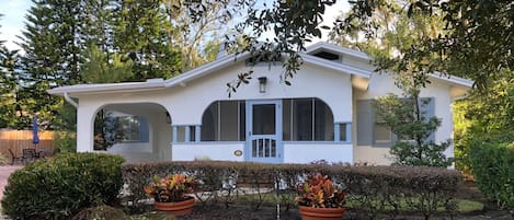 House with side patio, patio table, chairs/umbrella and gas grill(not shown)