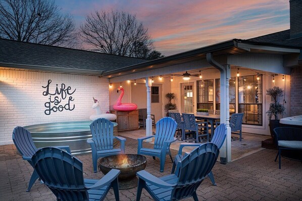 Back patio with cowboy pool, hot tub and fire pit