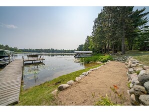 Sandy beach for the kids to play and private dock for your groups use.