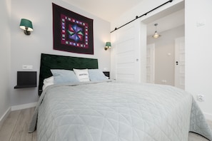The bedroom's modern design ensures a comfortable stay. 