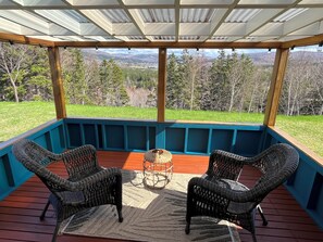 Covered sun room with view of Margaree River