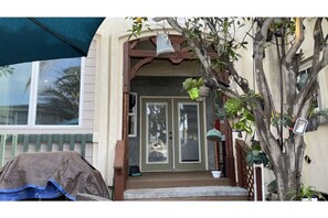 Double doors from the family room to back patio area, barbecue, outdoor dining