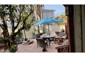 Back patio ,Barbecue, lots of seating. fenced so little partners can’t get out.