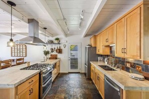 Well stocked kitchen that flows easily into breakfast nook, living room, den, or deck.