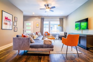 2nd unit: living room with Smart TV, comfortable seating and patio access