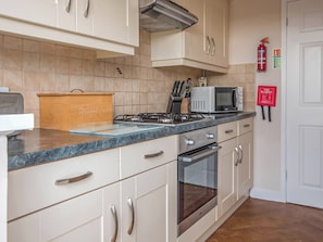 Kitchen | Gatekeepers Cottage - Celtic Haven Resort, Lydstep, near Tenby