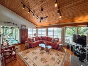 Breathtaking waterfront Living Room with panormaic views of Carter's Creek!