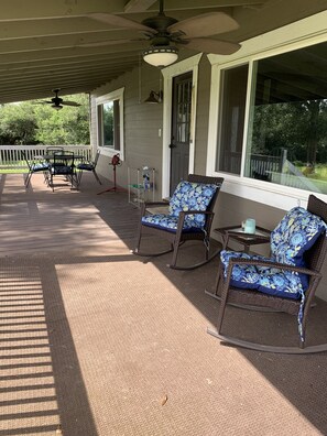 Back porch. Sitting area and outdoor dining area