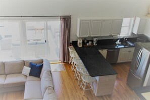 Kitchen & Living room area w/access to sun porch (upstairs)