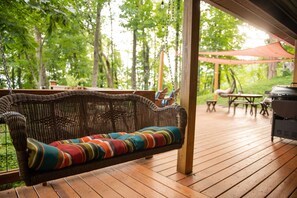 The covered porch swing lets you enjoy the outdoors even when it's raining.