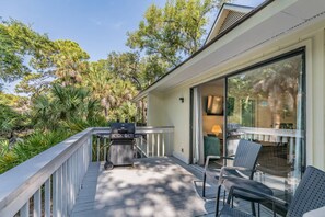 Back deck with seating and a grill!