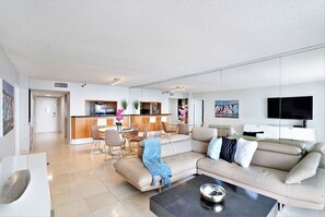 Living room, dining area, cable TV, balcony access