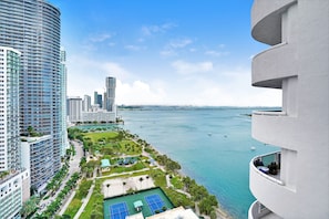 Furnished balcony with water views of Biscayne Bay and Margaret Pace Park