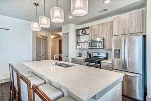 Expansive Kitchen with Stainless Steel Appliances