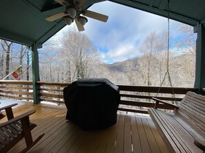 Front deck with gas BBQ grill, rocking chairs and  porch swing. to relax in.