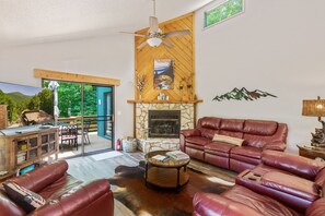 Comfy leather furnishings, 50" Smart TV, gas log fireplace..