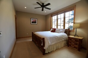 Master bedroom on main floor. Please note no curtains. Basic privacy shades.