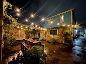 Shared Courtyard Oasis with Outdoor Lighting