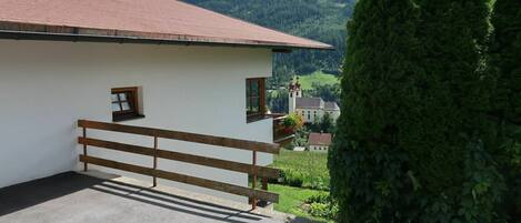 Plant, Building, Cloud, Property, Sky, Garage Door, Mountain, Tree, Land Lot, Architecture