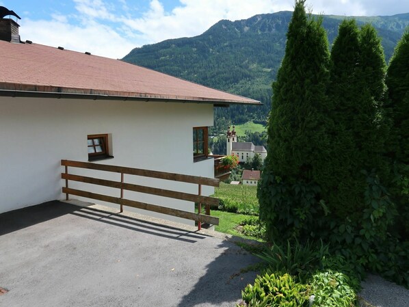 Plant, Building, Cloud, Property, Sky, Garage Door, Mountain, Tree, Land Lot, Architecture