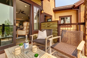 Private patio off Living Room with comfortable seating for four and breathtaking surrounding views of Canyons Resort and golf course